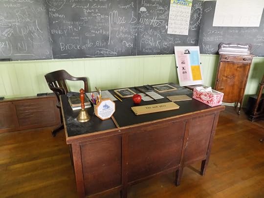 teachers desk and chalkboard