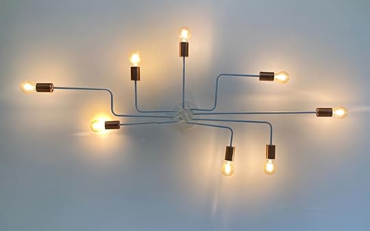 A modern light fixture in the shape of a mind map, with lights extending out in all directions.