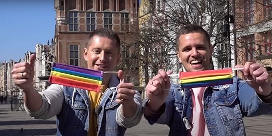 Gay couple handed out rainbow face masks in Poland