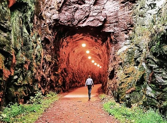 Person walking into a tunnel