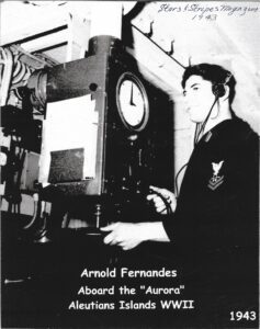 Arnold Fernandes operating sonar for a picture in Stars and Stripes Magazine 1943