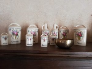 a row of small painted French vases