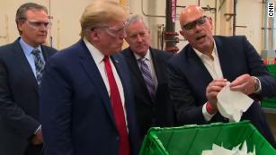 Trump doesn't wear mask to facility manufacturing masks
