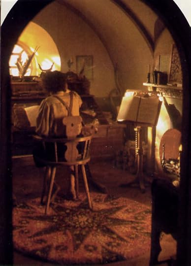 Hobbits make staying home cozy with books and candles