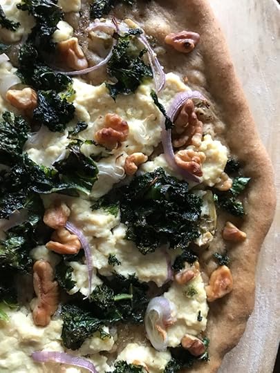olive-oil-based pizza with vegan ricotta, kale, shallots, and walnuts