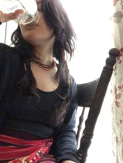 May Ling Su in igorot tapis drinks her water.