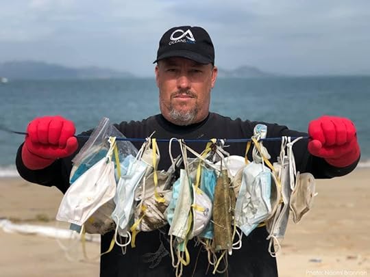 Person holding discarded face masks