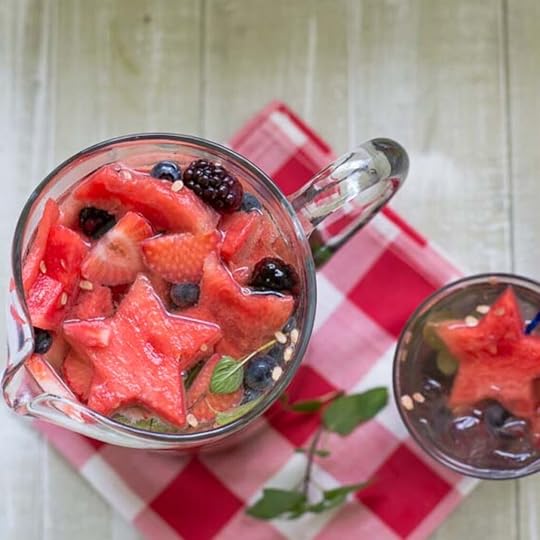 overhead photo of a fill glass pitcher of fruity sangria