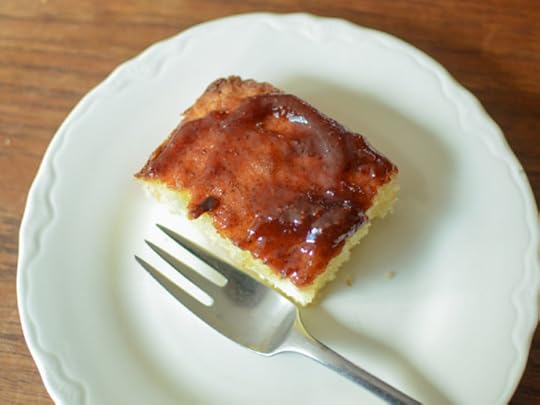Square of vanilla cake topped with strawberry jam