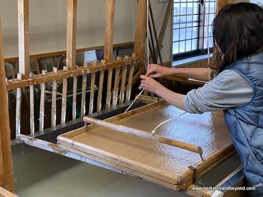instructor Masumi Hirata demonstrates paper-making at Iiyama Handicraft Paper Studio in Iiyama city, Japan