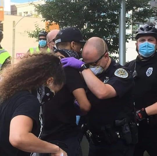 Protester and officer pray