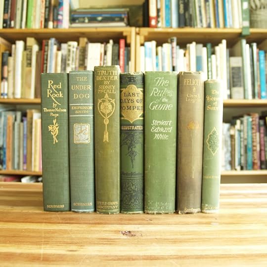 Seven antique books in green bindings