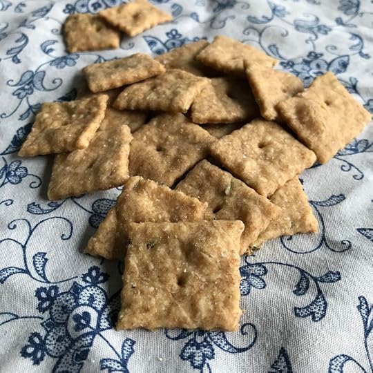 sourdough crackers on a white napkin with blue flowers