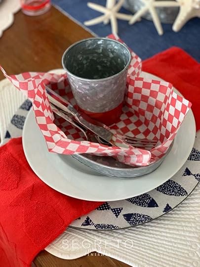cup & silverware in paper napkin within a bowl