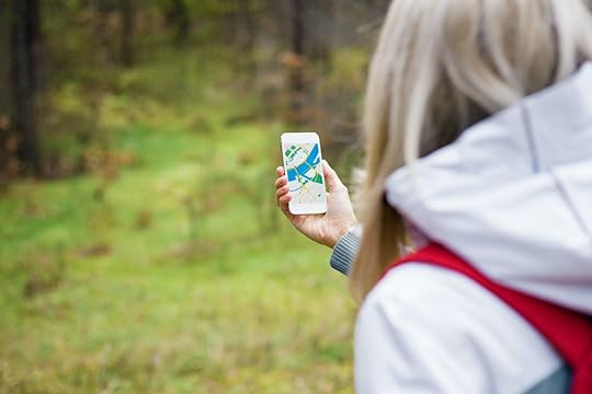 Person geocaching in forest