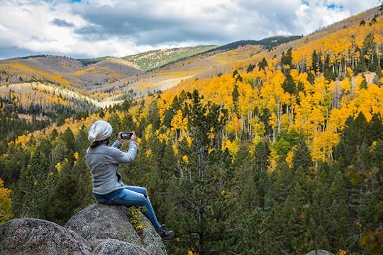 Woman sitting on a boulder near Santa Fe