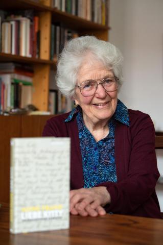 Laureen Nussbaum sitting at table<br />