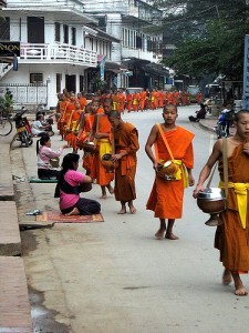 Buddhist monks accepting alms in Luang Prabang, Laos