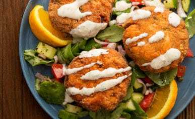 salmon cakes with horseradish cream and a summer salad