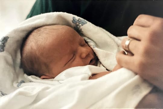Becca holding her first-born.
