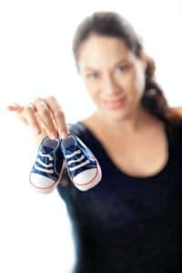 Intentional parents - mom holding baby shoes