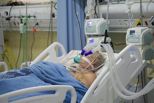 Elderly white Covid-19 patient on a ventilator in ICU