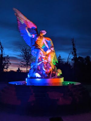 Evermore Statue Lit Up at Night