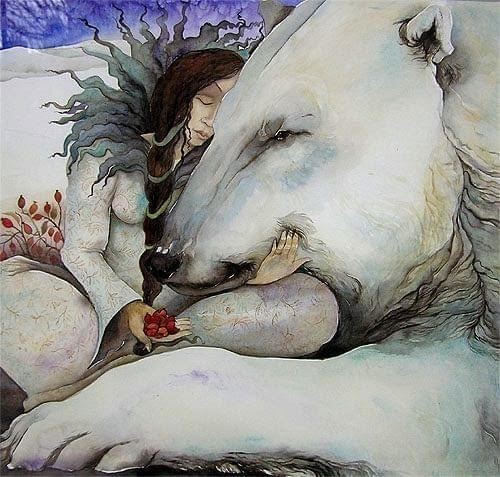woman hugs polar bear