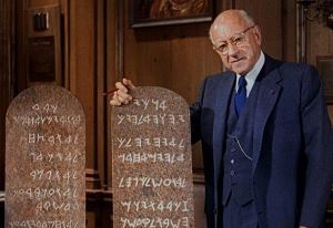 Cecile B. DeMille holds 10 Commandment Tablets