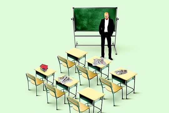 Teachers stands in front of empty classroom.