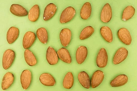 almonds on a green background