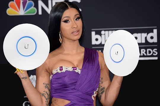 Cardi B is holding two Ubiquiti WAPs
