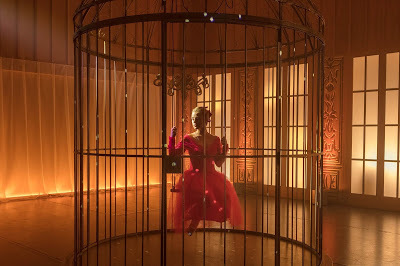 Lena trapped in a cage as Clara in a reimagining of "The Nutcracker"