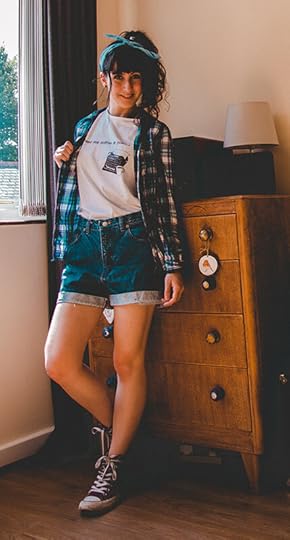 Me wearing a minimalist t-shirt with an unbuttoned shirt