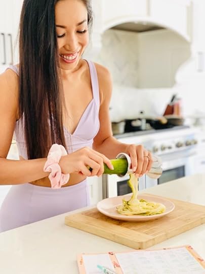cassey ho blogilates spiralized zucchini noodles on a plate and cutting board