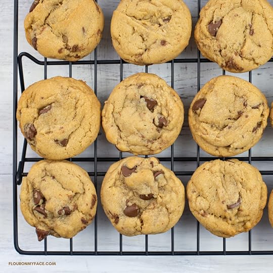 Homemade chocolate chip cookies cooling on a wire cooling rack