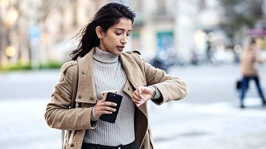 young woman looking at a watch