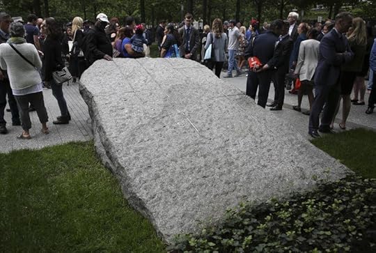 People gather around stones that are part of a new 9/11 Memorial Glade on May 30 on the grounds of the National September Memorial and Museum after the Glade's dedication ceremony in New York. Set in a glade of trees during the spring 2019, the granite slabs recognize an initially unseen toll of the 2001 terror attacks: firefighters, police and others who died or fell ill after exposure to toxins unleashed in the wreckage.
