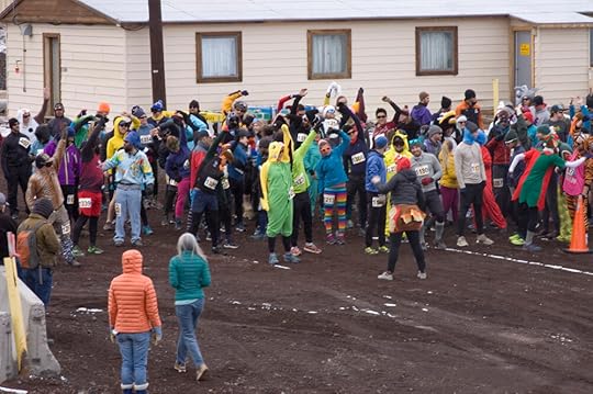 The rainbow assembles – the figure centre-right with the splayed legs is wearing a turkey costume.