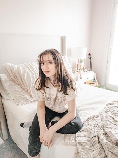 Boho Chic Bedroom, girl sitting on bed, distance learning space
