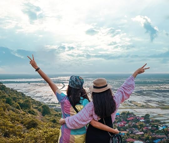 two woman standing during daytime