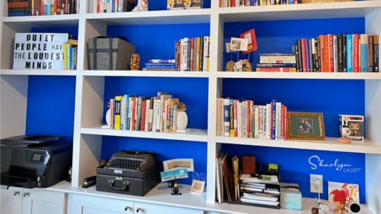 video background bookshelf with a variety of books and personal items