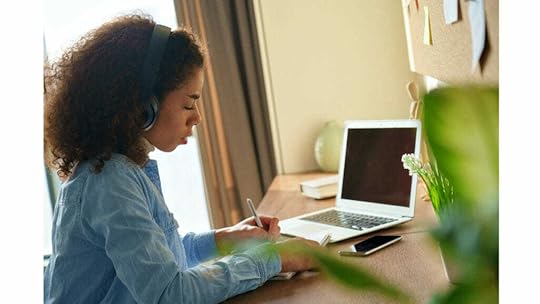 remote employee working at home desk on performance management evaluation