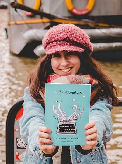 Me holding my poetry book, 'Will-o'-the-Wisps'