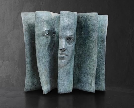 Pensive Faces Peer Out From the Pages of Bronze Book Sculptures by Paola Griz