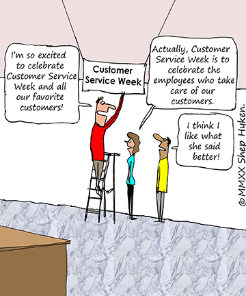 Employee Hanging Up a Banner For Customer Service Week in the Office