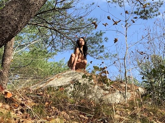 May Ling Su birthday nude Artemis with antlers at the top of a cliff in the woods.