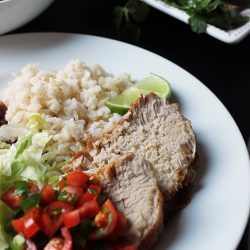 slices of cumin pork loin on dinner plate