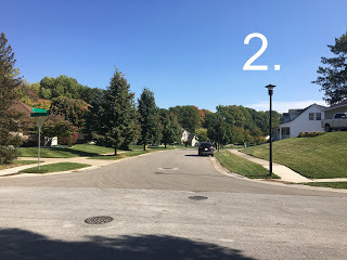 Photo of a street, caption "2"