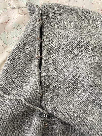 More pre-seaming—this is the sleeve insert section so the sleeve is attached to both the sweater back and the front piece. You can also see the sweater back and the front piece pinned together for the side seam on the bottom of the photo.